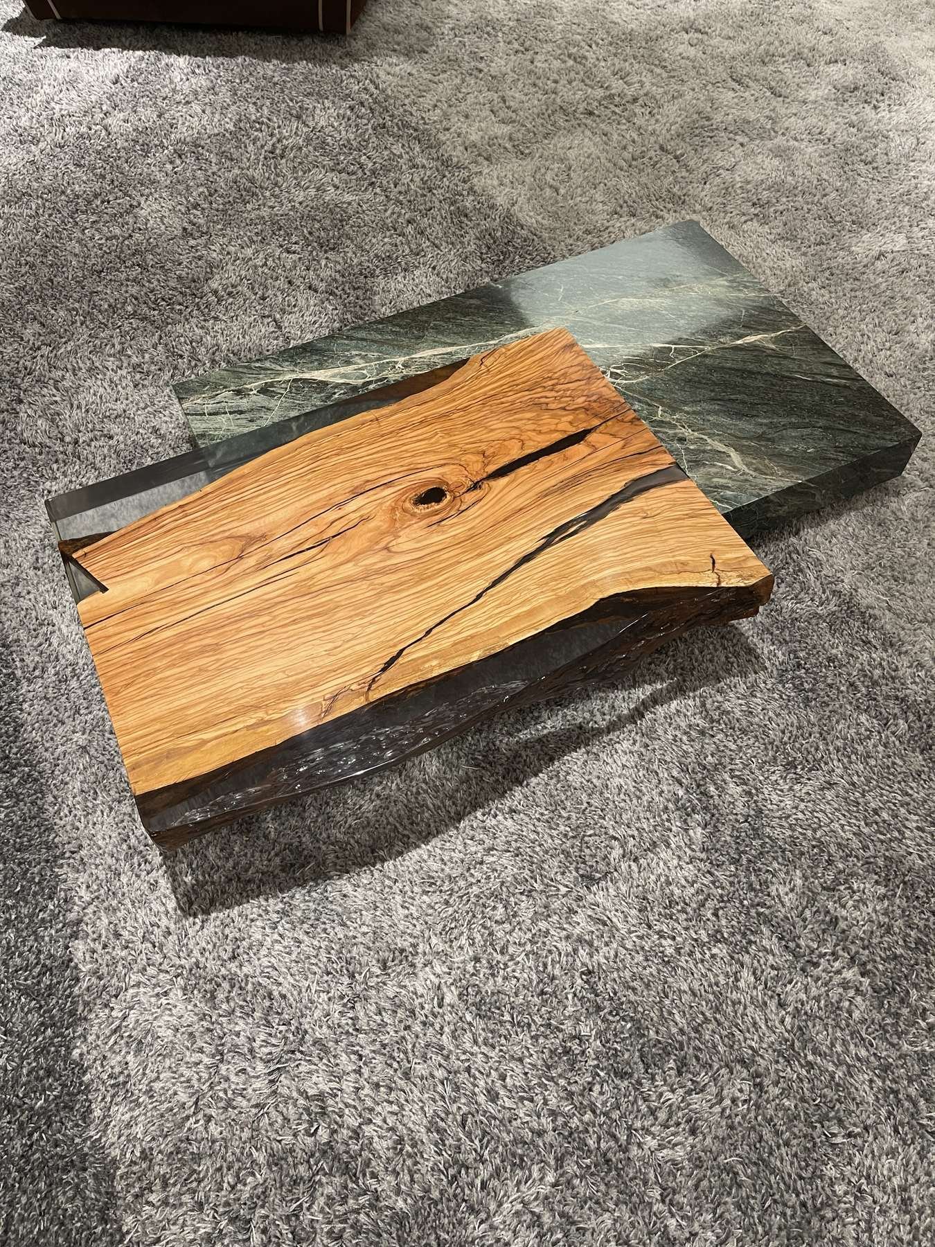 Marble coffee table inspected for surface defects before shipment